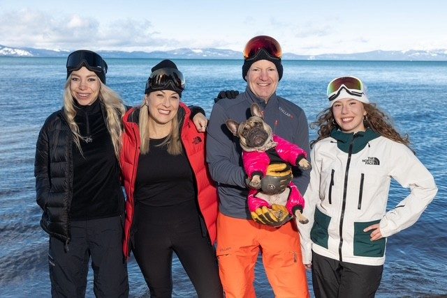 Dyna Boen with her family and their French bulldog at the shore of Lake Tahoe