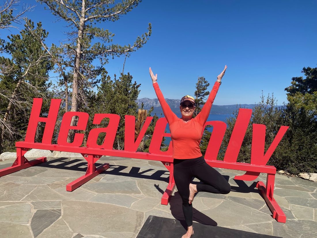 Dyna Boen at the Heavenly Mountain Resort sign above Lake Tahoe